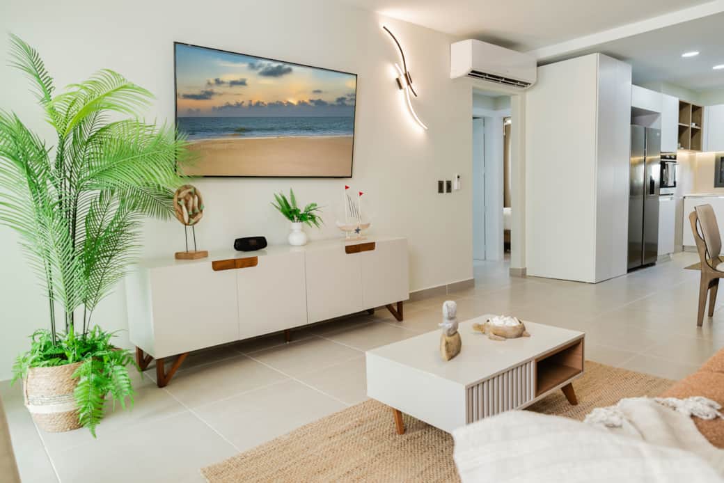 Stylish Living Room with Smart TV and Open Modern Kitchen