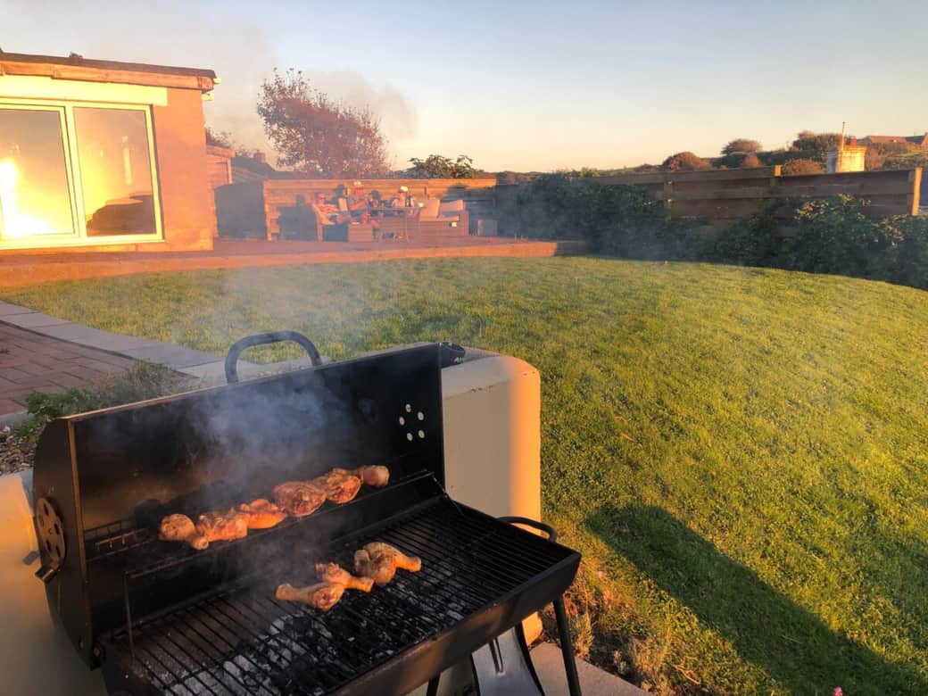 Cooking a  BBQ at the large seaside house close to Little Haven beach, Pembrokeshire. great sunset 