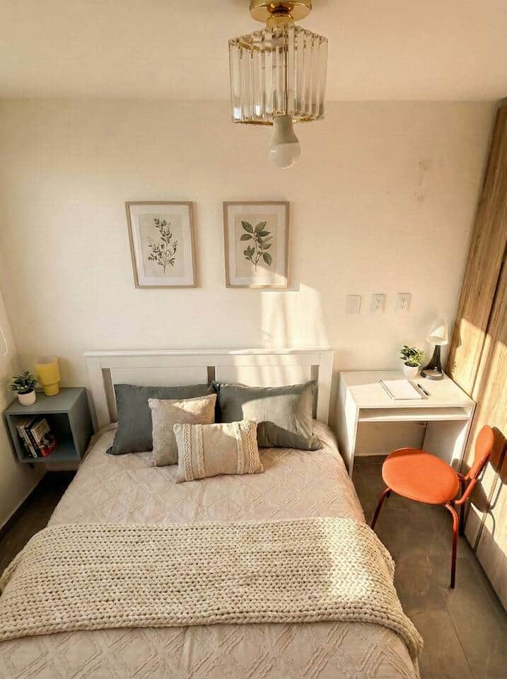 Work-friendly corner with a clean white desk, task lamp, and comfy orange chair—set by the window for great natural light. Ideal for remote work, study sessions, or planning your day in a calm, cozy bedroom. Work-friendly corner with a clean white desk, task lamp, and comfy orange chair—set by the window for great natural light. Ideal for remote work, study sessions, or planning your day in a calm, cozy bedroom.