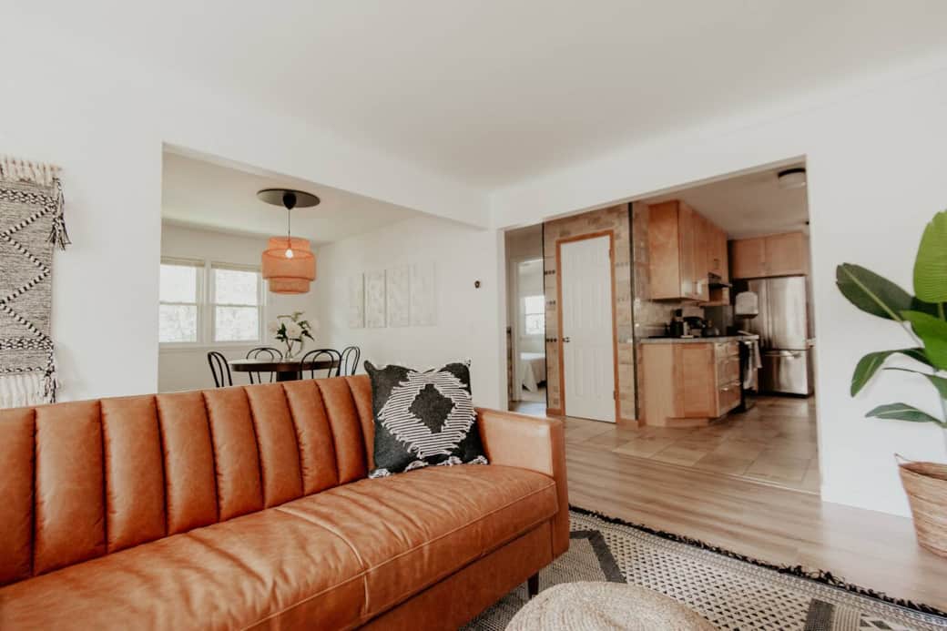 Living room with smart tv and leather couch