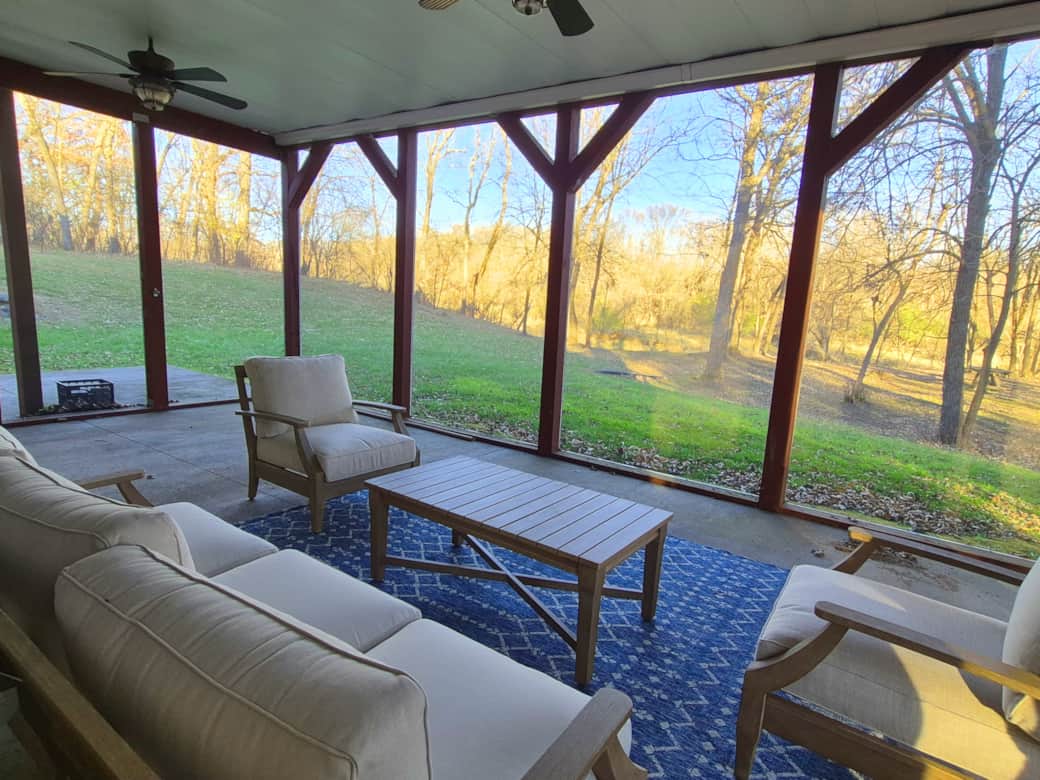 The screened porch feels more like an outdoor living room!