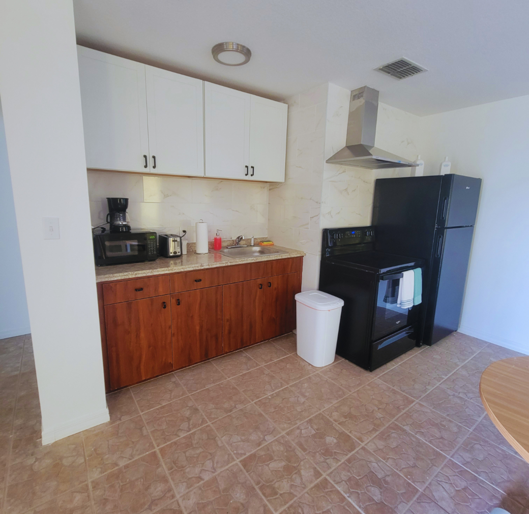 Fully equipped kitchen with stove, oven, refrigerator, microwave, and coffee maker. Lakeland, FL Fully equipped kitchen with stove, oven, refrigerator, microwave, and coffee maker. Lakeland, FL