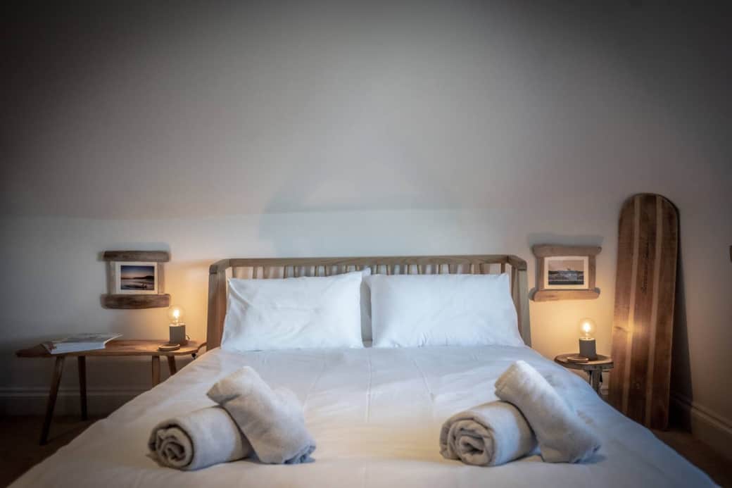 Master bedroom is decorated to be a light and airing space with a mix of natural woods and fabrics. Amazing views over the harbour.
