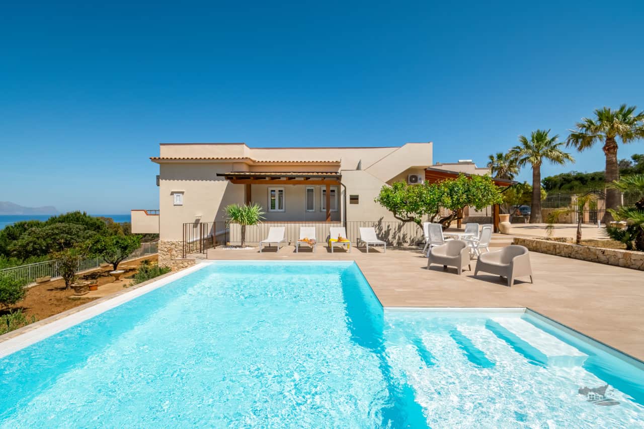 Enjoy the inviting infinity pool with a shallow area perfect for relaxing.