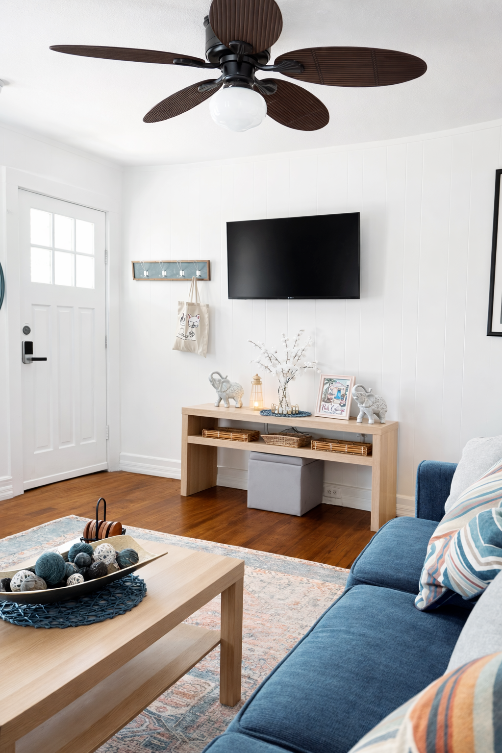 Bright, cozy living room with large TV and comfortable seating