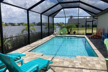 Pool lanai, ample seating, propane grill. 