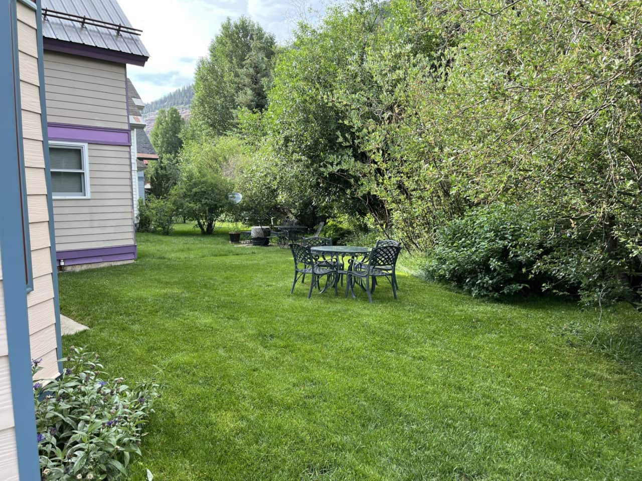 Comfortable backyard with outdoor seating - perfect for al fresco dining or yard games!