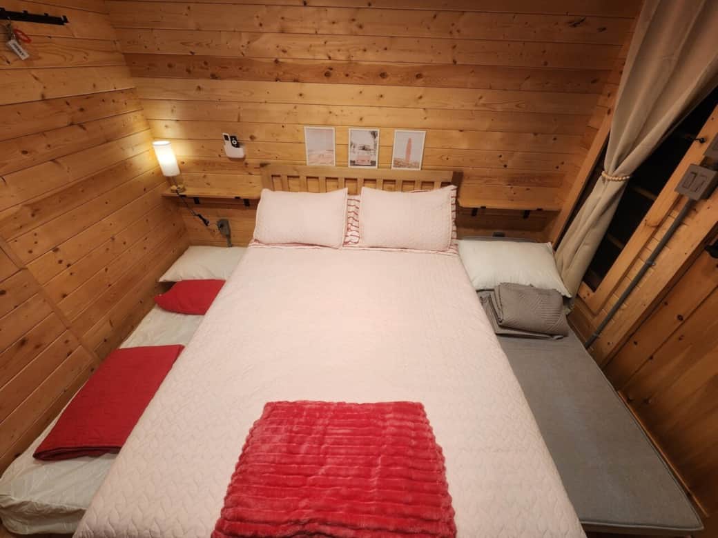 Queen bed with single trundle and single fold out chair extended