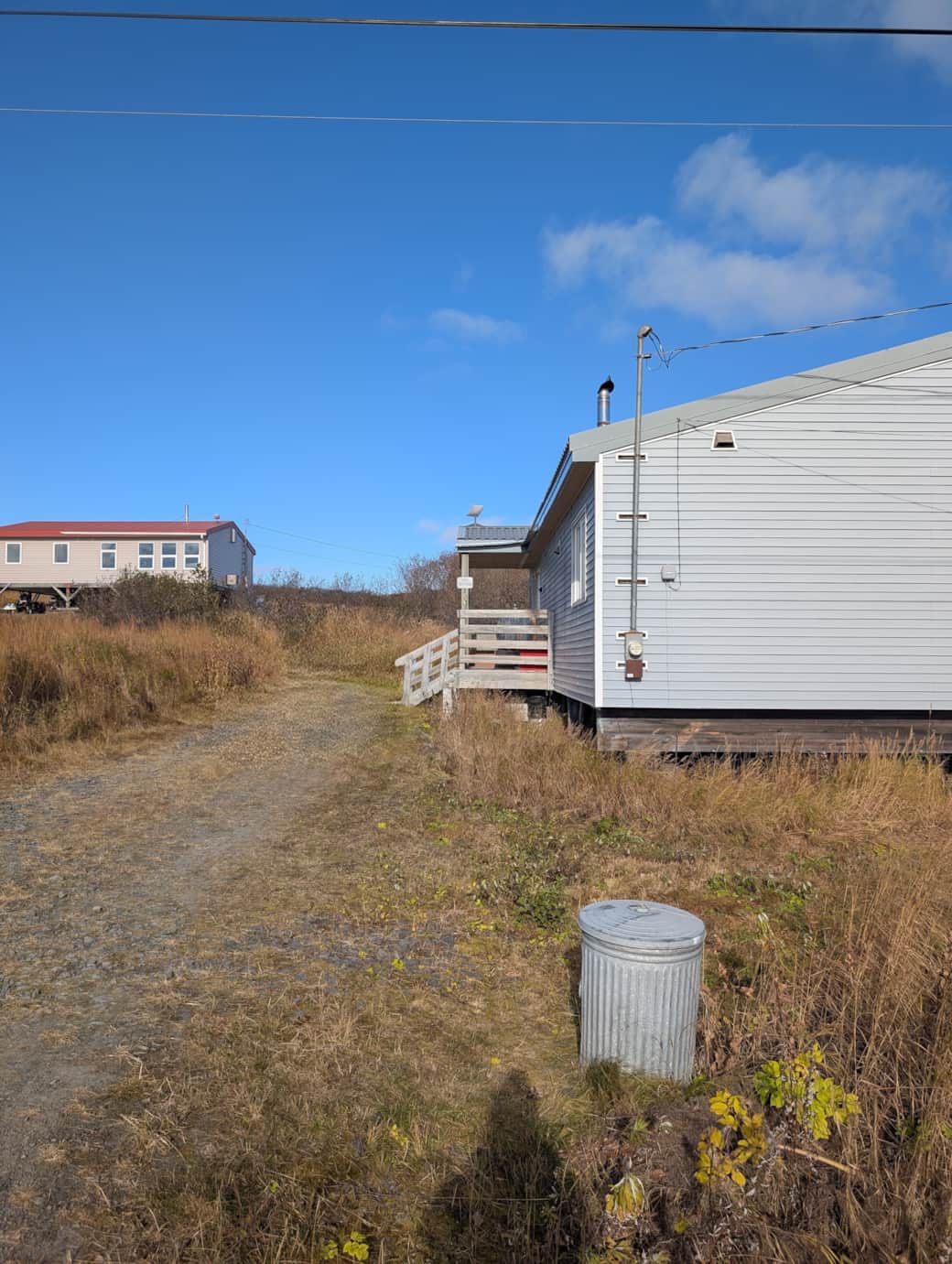 View of driveway with parking in front but also on south side of home