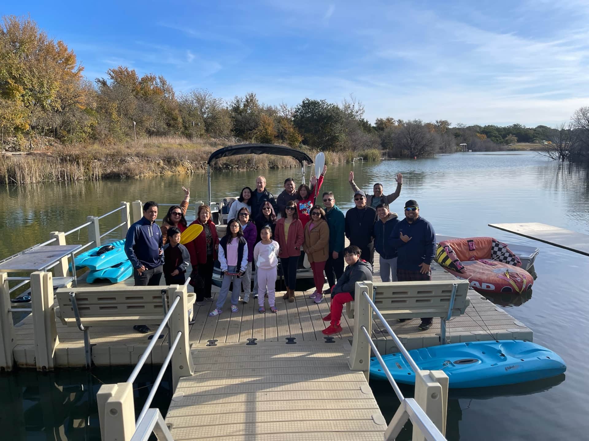 Multi-generational family group posing together during their reunion at Lake Godstone