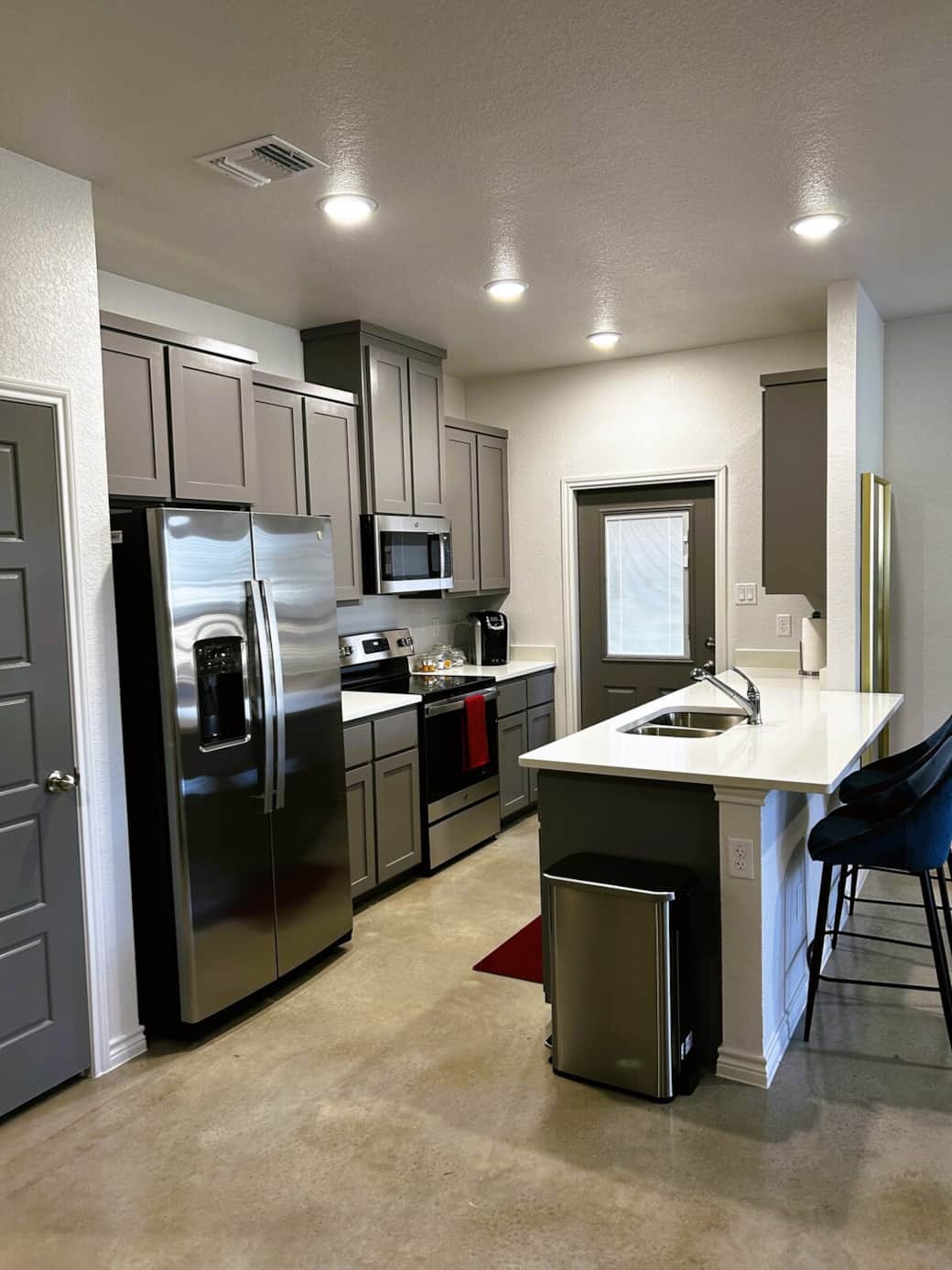 Kitchen is equipped with all basic cooking and dining utensils as well as Keurig, electric kettle, 10 cup coffee maker, food processor, and spice rack