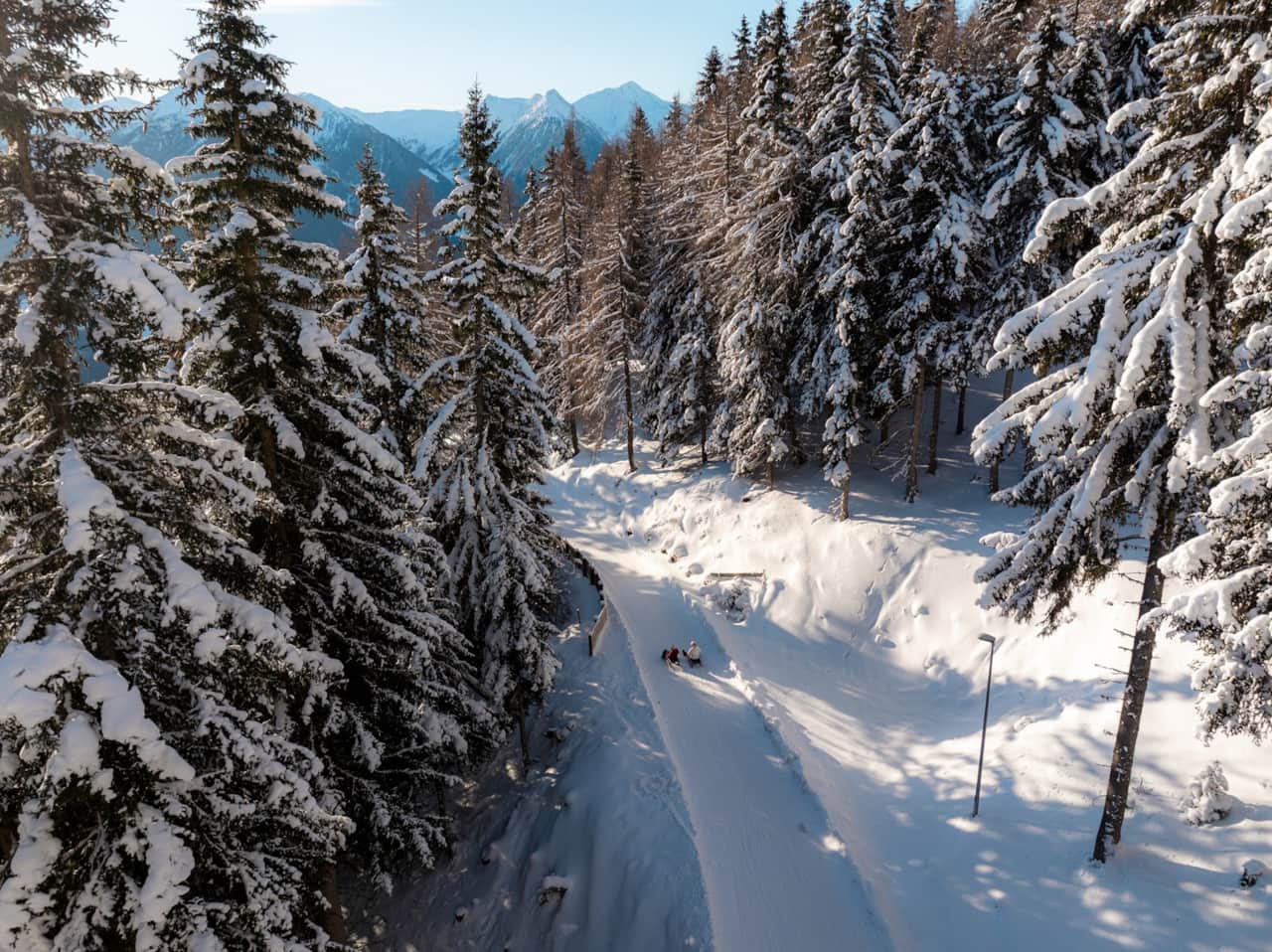 Winter sledding – snowy slopes and alpine scenery in South Tyrol.