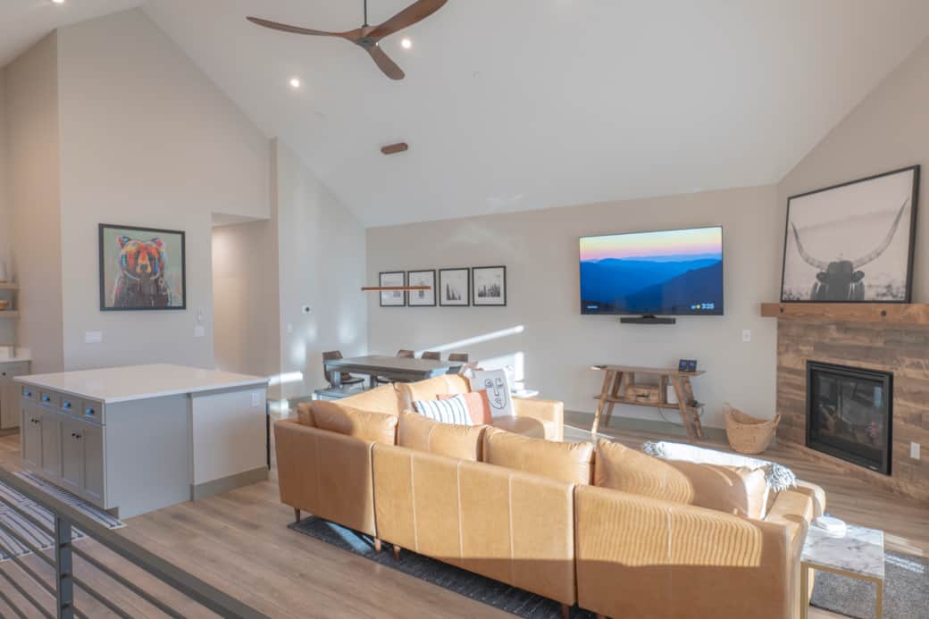 Upstairs offers a spacious open-concept living area, perfect for relaxing and socializing.