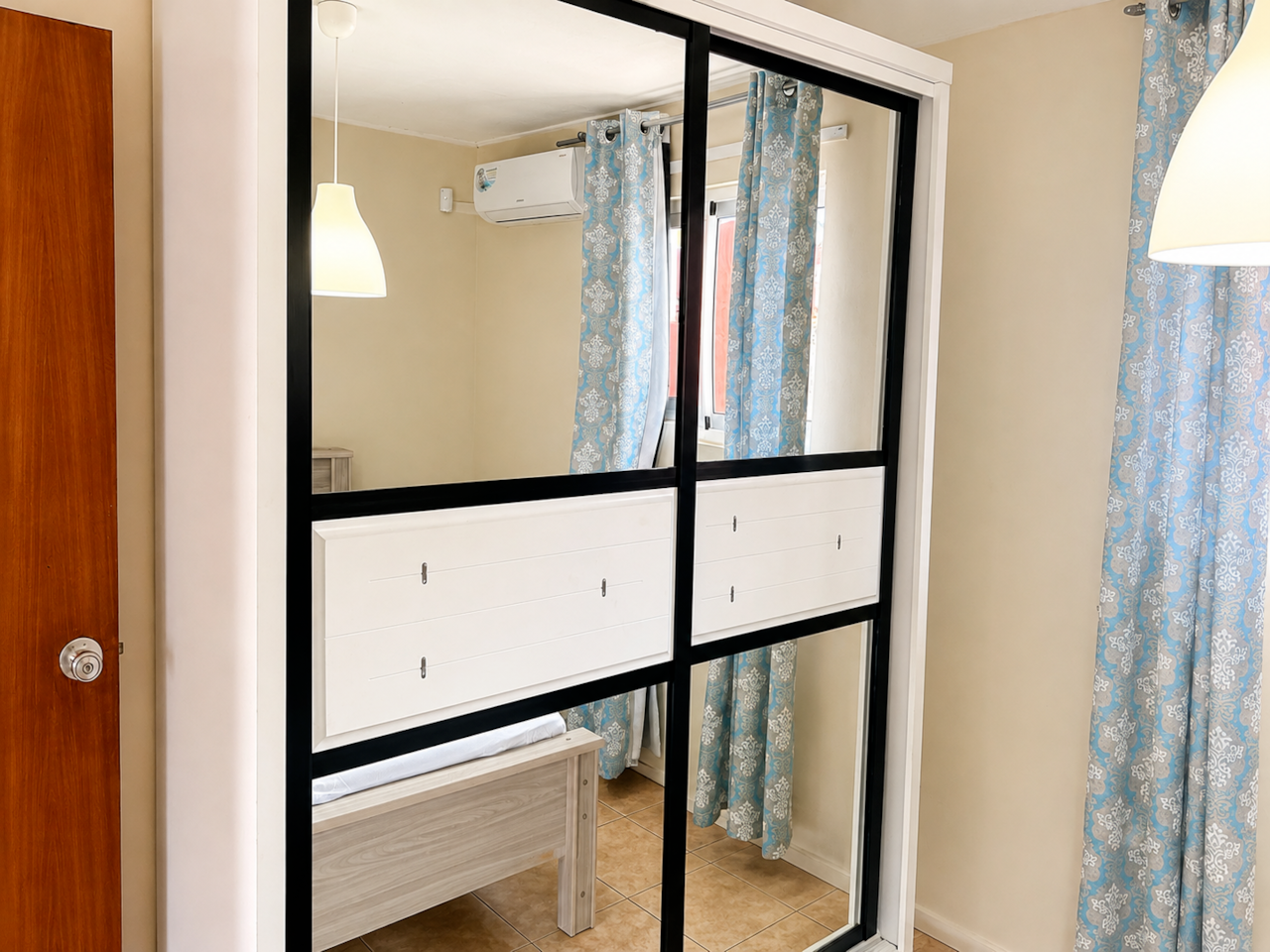 Large wardrobe with mirror for convenient storage and getting ready.