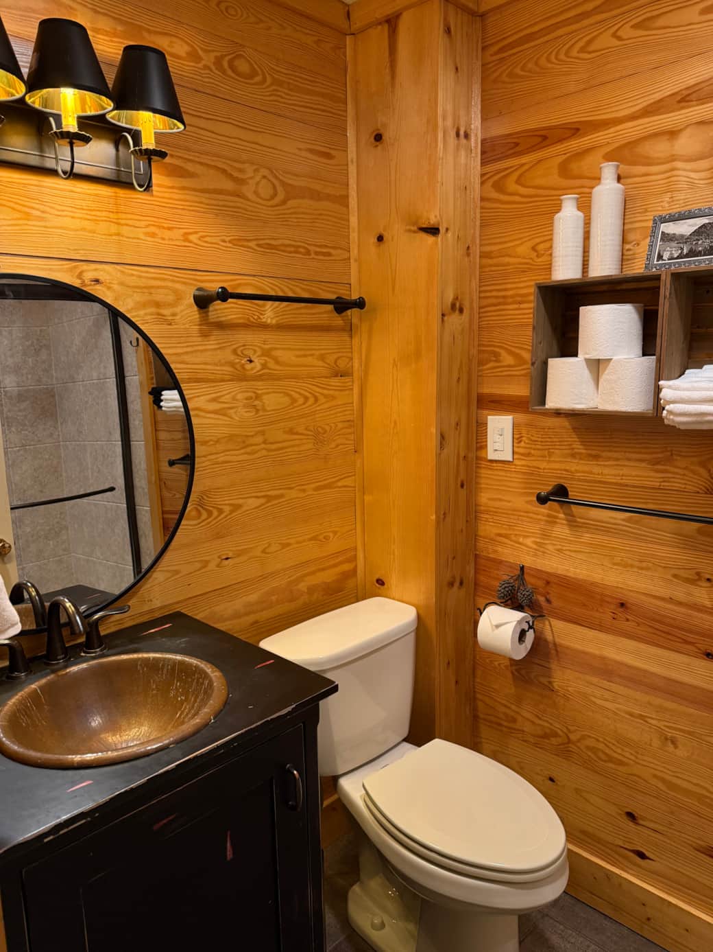 This bathroom is recently renovated with pine walls and full shower with sliding doors.
