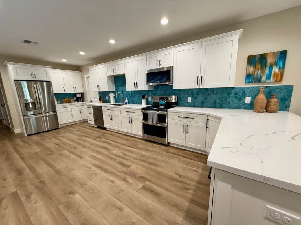 Fully stocked chef's kitchen with walk in pantry. 