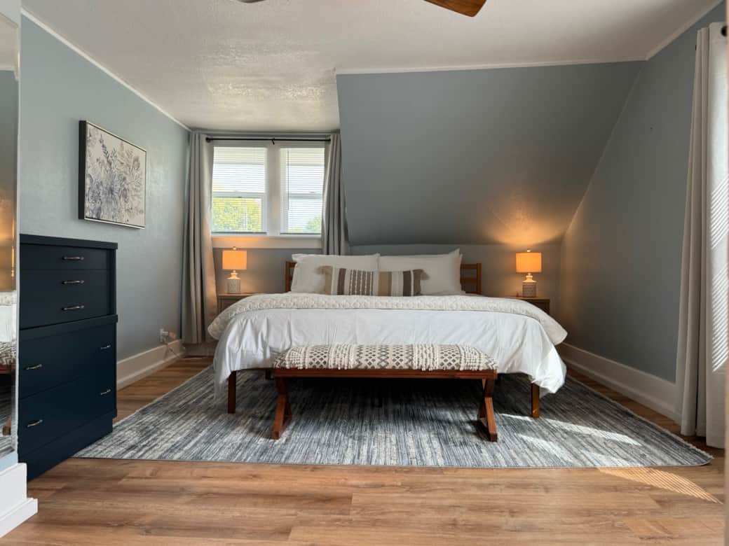 Bedroom 1 with King Bed and premier bedding.  AC and USB plug-ins on both nightstands