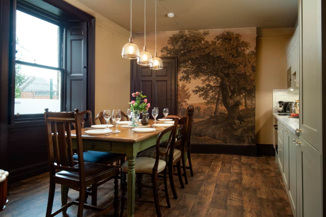 Mad Hatter's tea party kitchen! Tree mural, rustic dining, and fully equipped: oven, hob, fridge, di