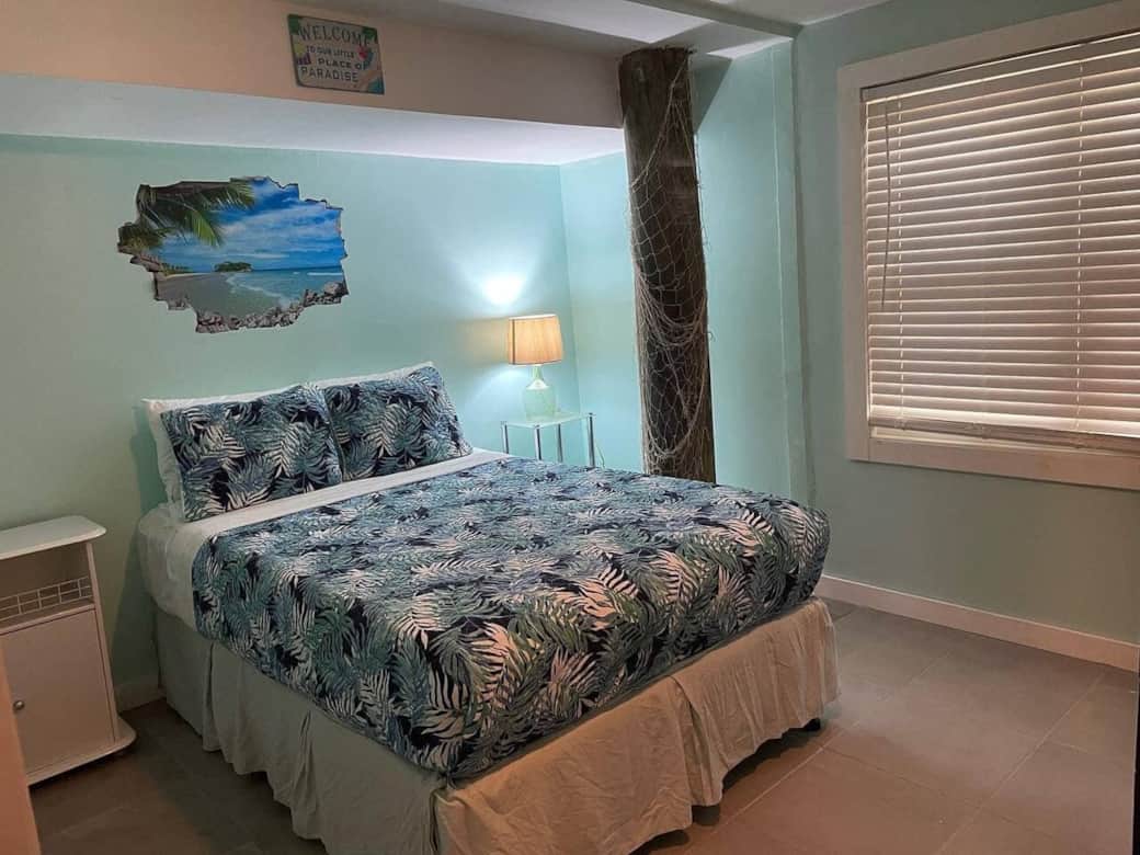 Large bedroom with separate AC unit and wardrobe.