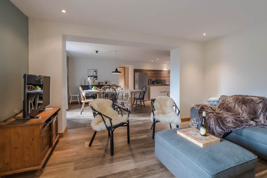 Cozy TV lounge with corner sofa, 45" screen offering Netflix, Prime, Disney+ and Chromecast.