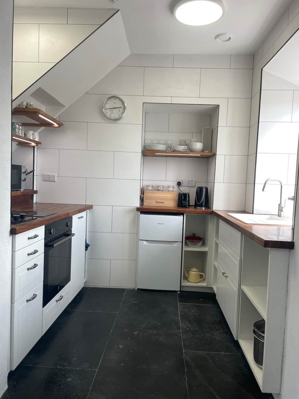 Full kitchen with everything you could need in a surprisingly compact space. 