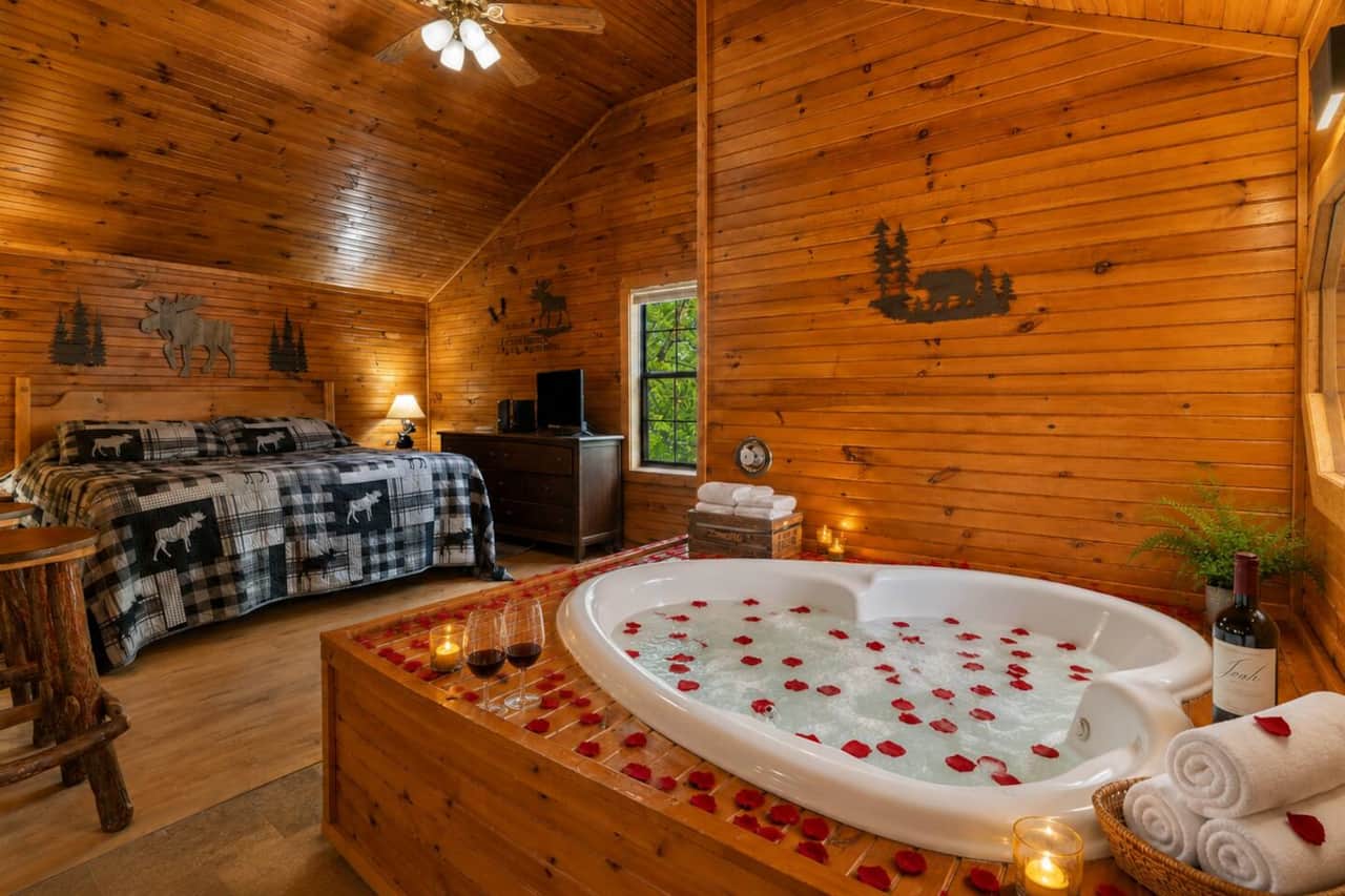 Candlelight, rose petals, and a heart-shaped jacuzzi — the ultimate romantic soak in the loft suite.