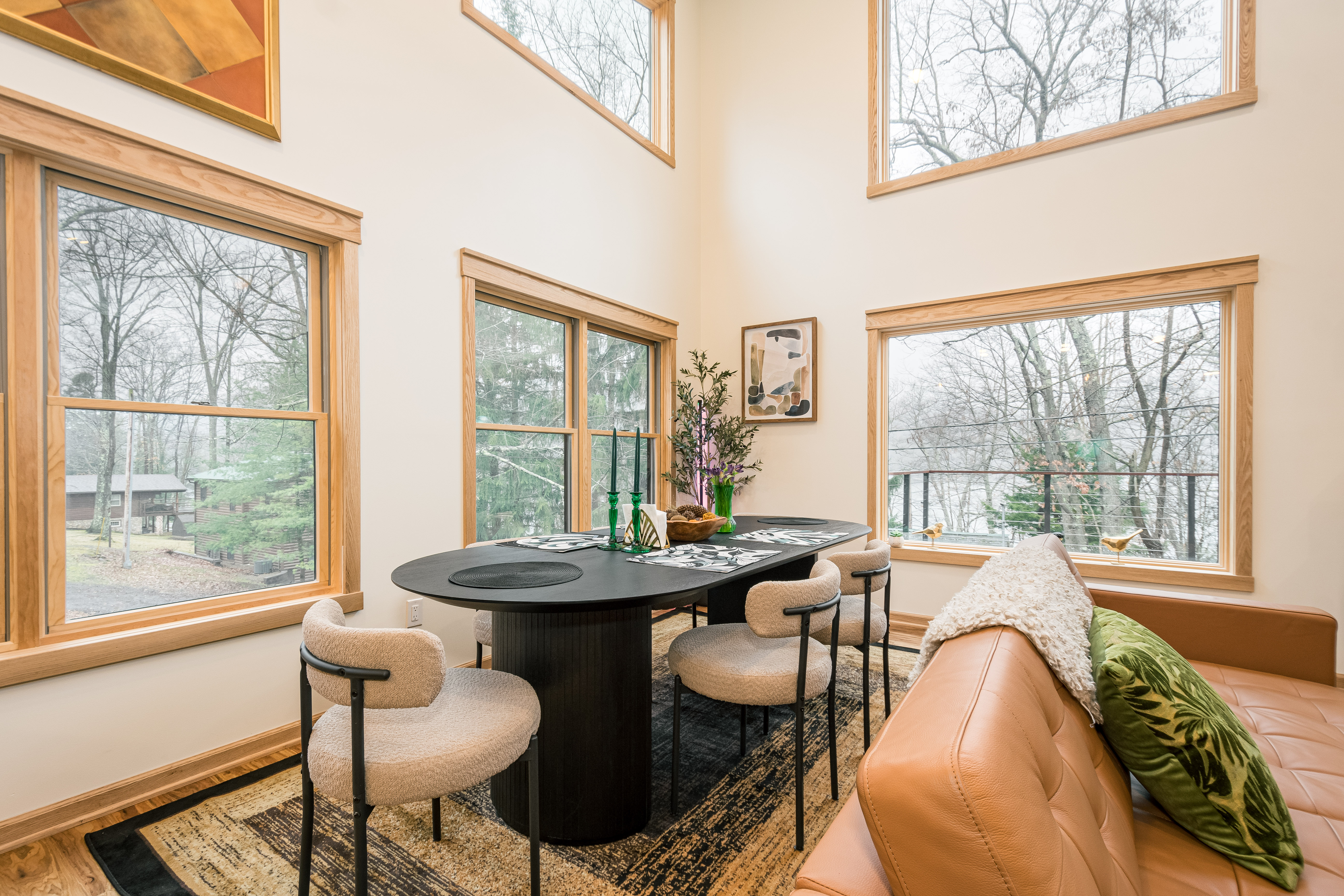 Dining table under tall windows