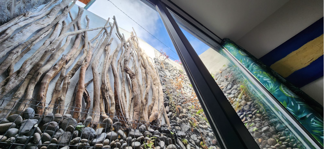 Floeca bedroom retreat with a calming stone-and-wood patio view straight from the bed Floeca bedroom retreat with a calming stone-and-wood patio view straight from the bed