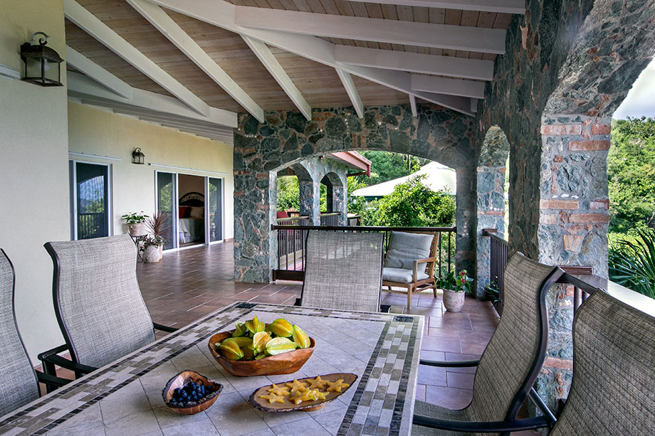 Expansive stone covered veranda with plenty of seating