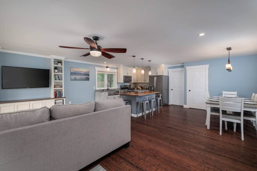 The open concept kitchen, living and dining space allows you and your family to enjoy time together while both cooking and eating meals.