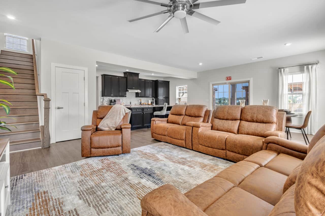     Bright and inviting living room with comfortable seating for the whole group