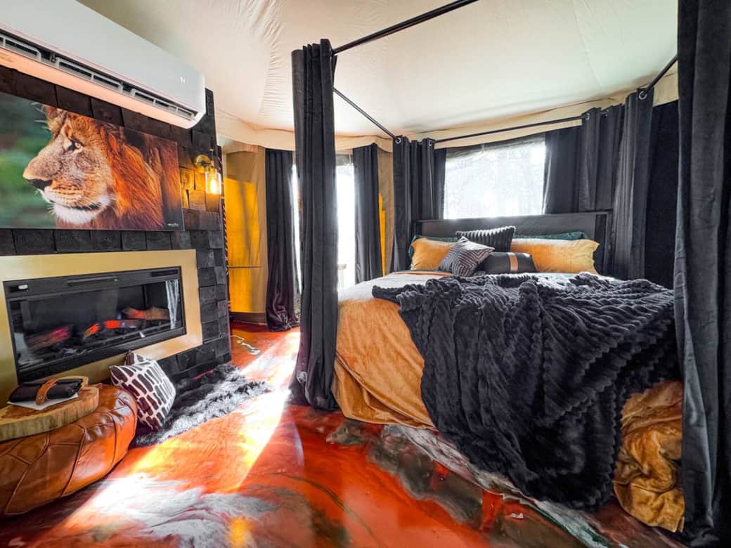 Step into your romantic sanctuary, where a luxurious four-poster bed, draped in black velvet curtains, awaits. The rich gold bedding and soft faux rugs create the perfect escape, a romantic weekend getaway, or honeymoon. Just outside of Dallas. Step into your romantic sanctuary, where a luxurious four-poster bed, draped in black velvet curtains, awaits. The rich gold bedding and soft faux rugs create the perfect escape, a romantic weekend getaway, or honeymoon. Just outside of Dallas.