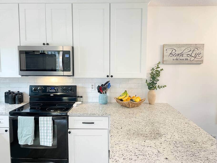 Main floor fully functioning kitchen with dishwasher and other appliances.
