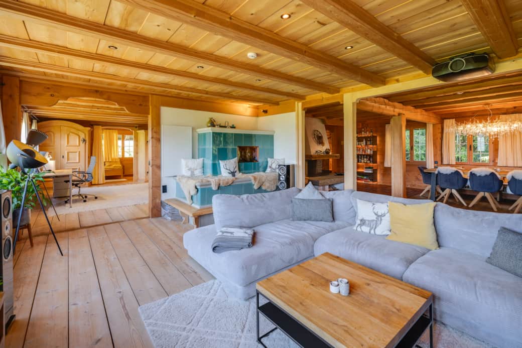 Large living room with mountain views, tiled stove, state-of-the-art home theater, gaming consoles
