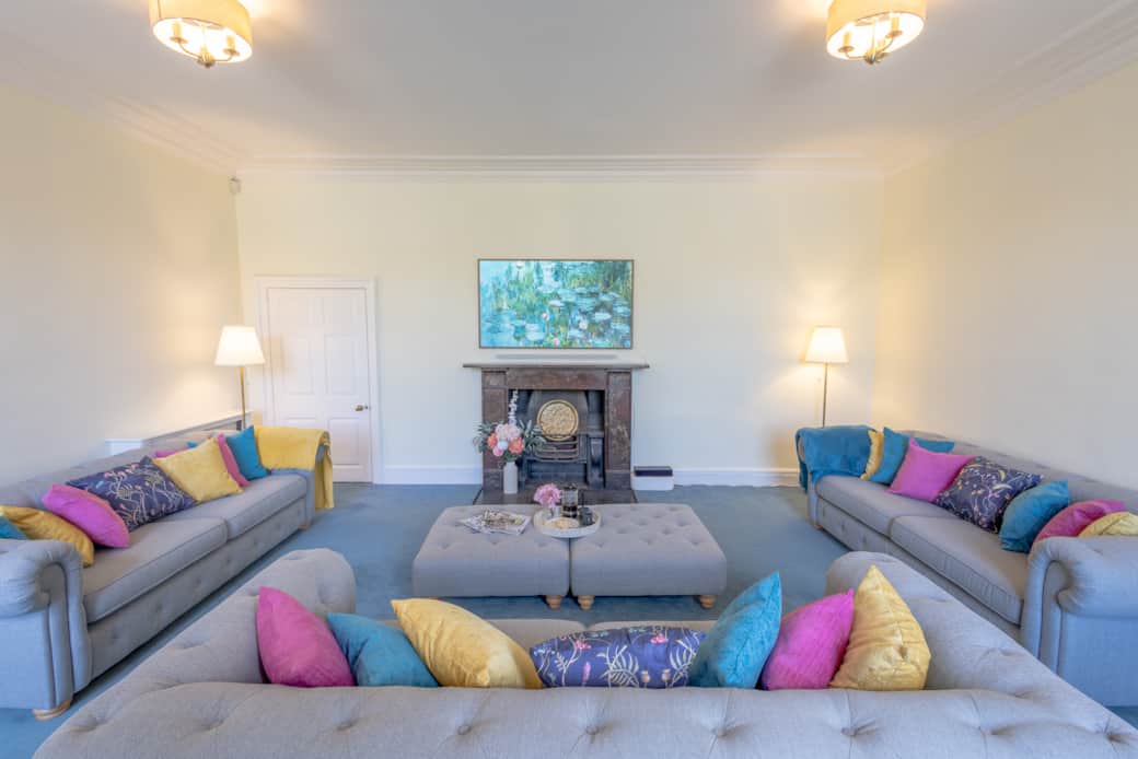 The Old Rectory sitting room, view of the sofas & televison