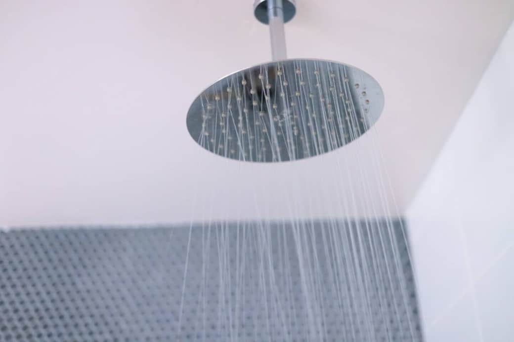 At the end of a full day, step into the glass-enclosed Moen rain shower with unending hot water.