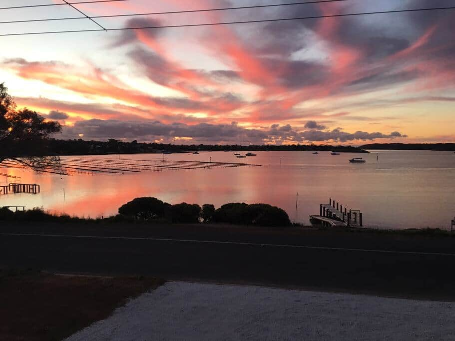 It's common to see sunsets like this looking across the bay from your apartment.