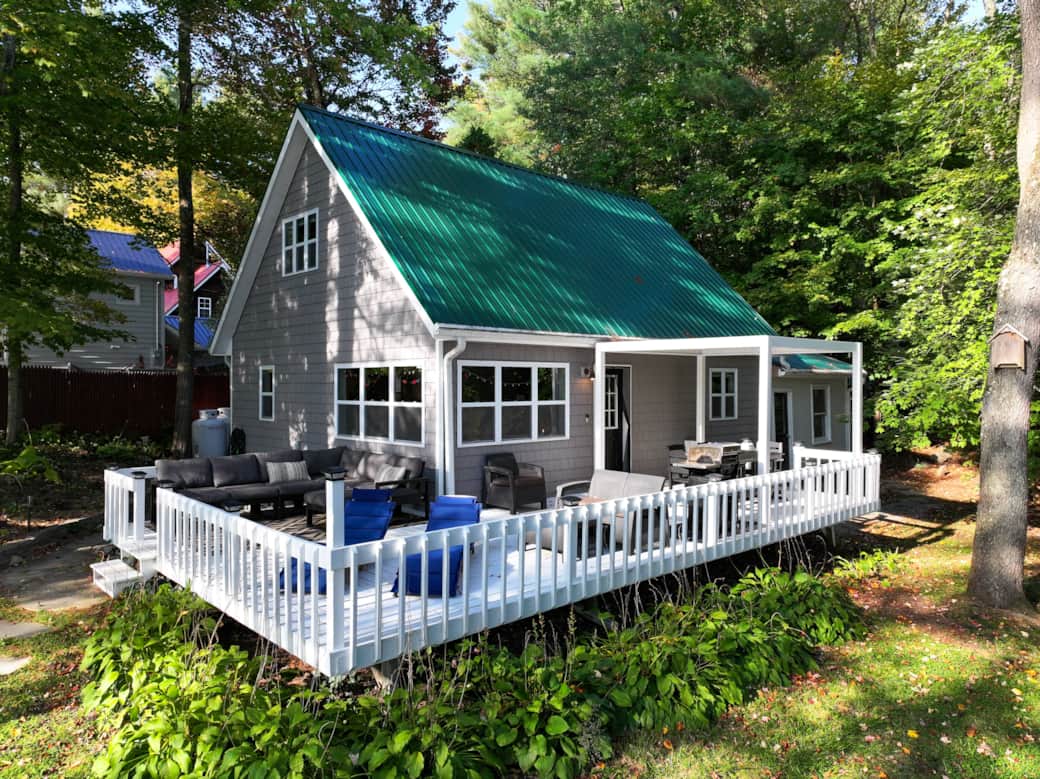 Indulge in outdoor living with our inviting patio, plush seating and covered dining area