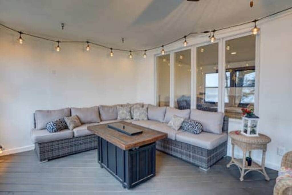 Seating for 6 around the fire table on the screened in porch