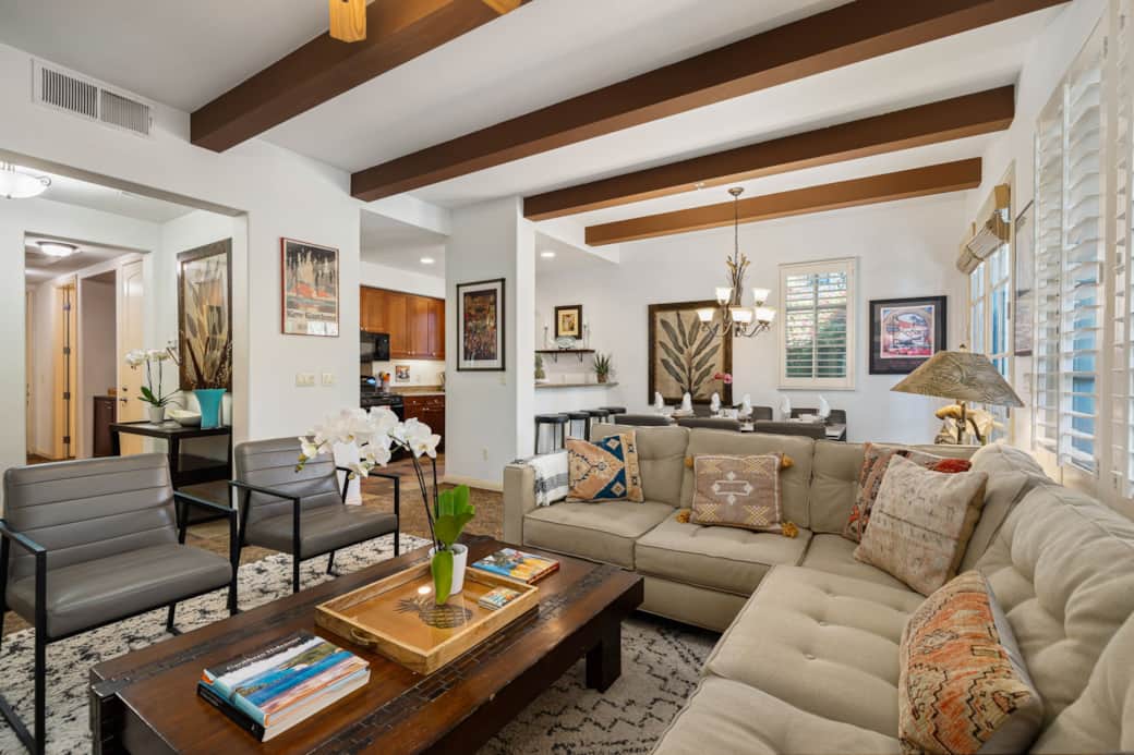 Open and welcoming living space with seamless flow between the living room, dining area and kitchen