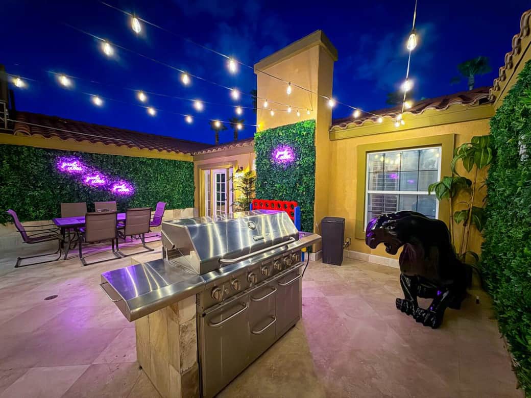 Jungle-themed center courtyard with 2 black panthers, outdoor dining, and BBQ