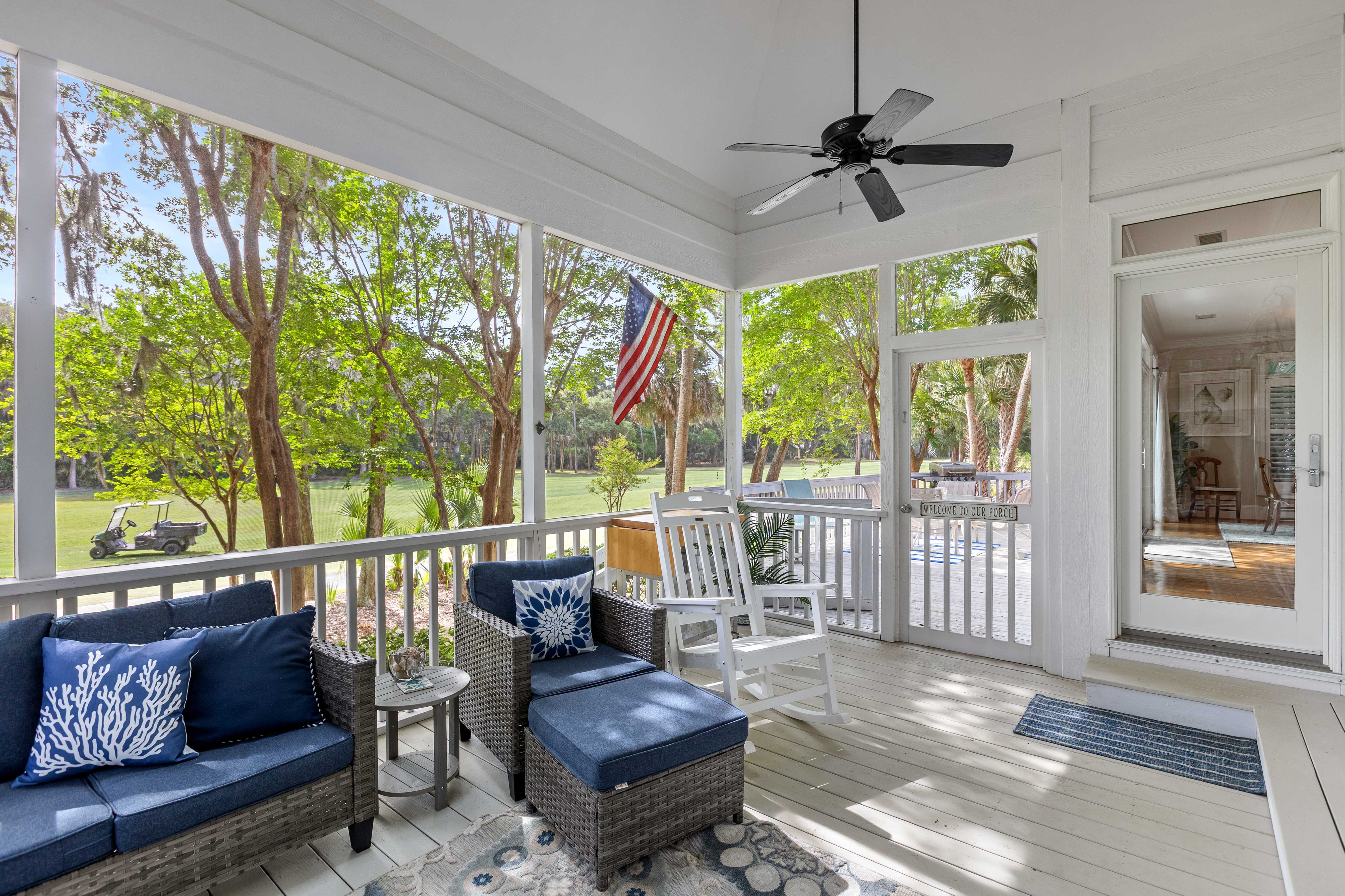 Rocking chairs at the far end of the porch
