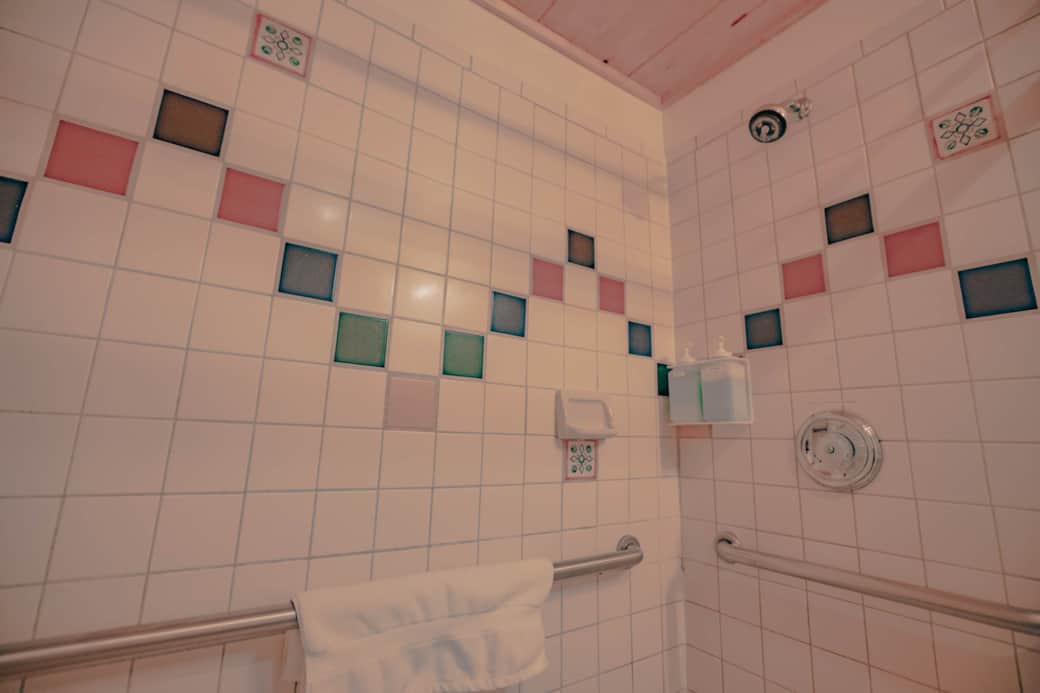 ADA restroom with handrails.