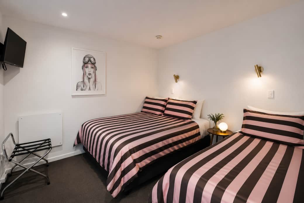Second bedroom with a queen and single beds both with pillow-top comfort Second bedroom with a queen and single beds both with pillow-top comfort