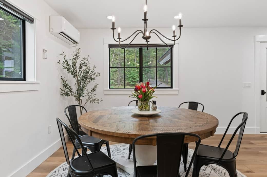 There is pleasing natural light in this dining room. A round country cottage farm table will seat the entire party. Enjoy this heated or cooled area while gathering around the table. Need a great area to play some cards or board games? BINGO