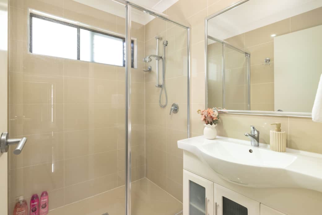 Bathroom: Stylish bathroom with walk-in shower, vanity, and clean finishes 