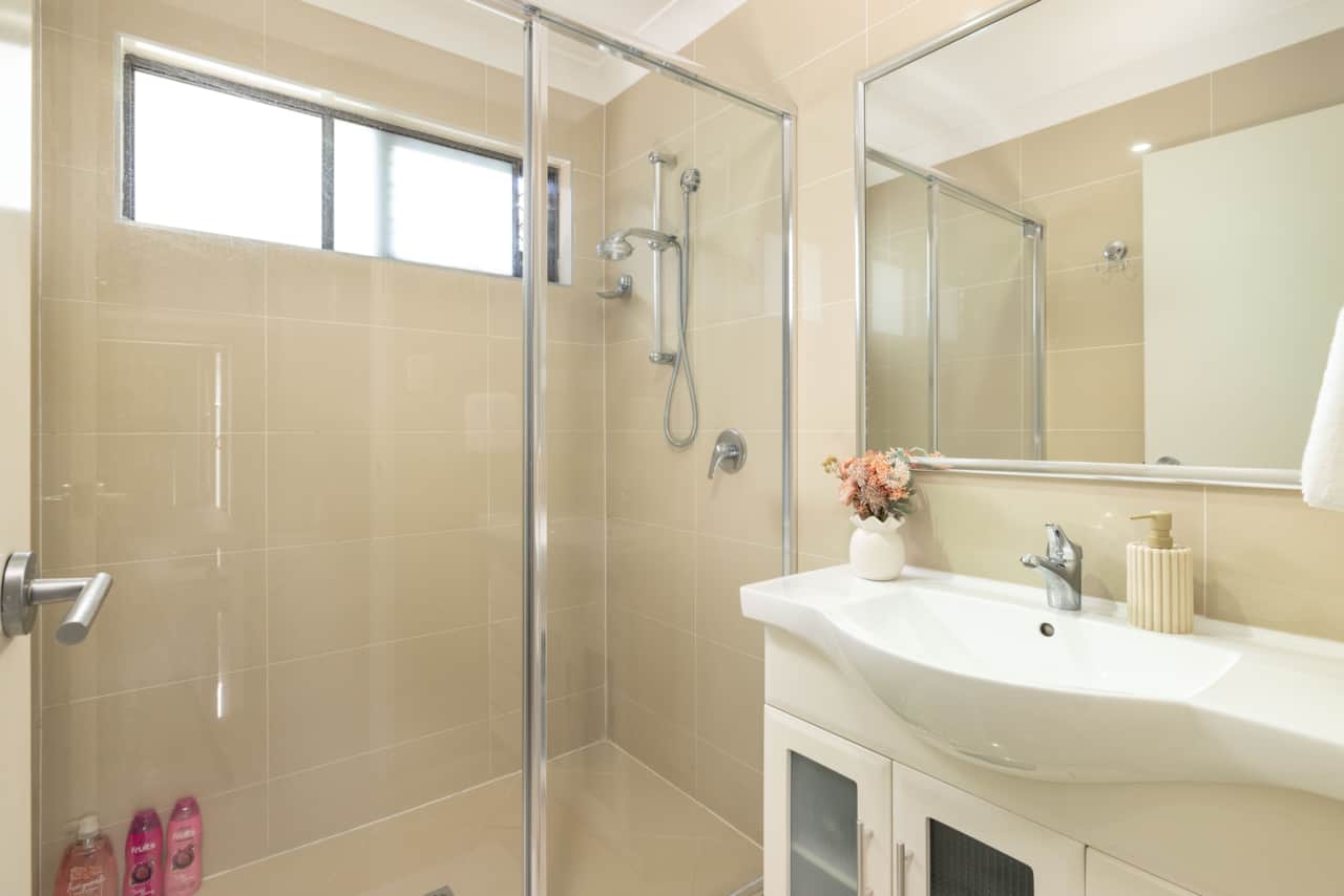 Bathroom: Stylish bathroom with walk-in shower, vanity, and clean finishes 