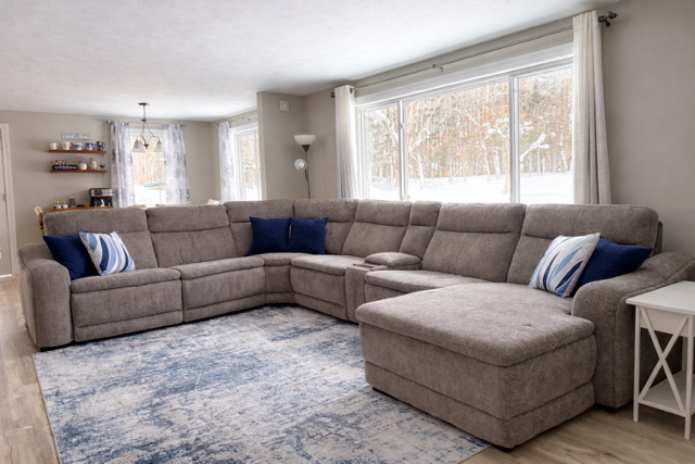 Bright, open living space with plush seating and abundant natural light. Bright, open living space with plush seating and abundant natural light.