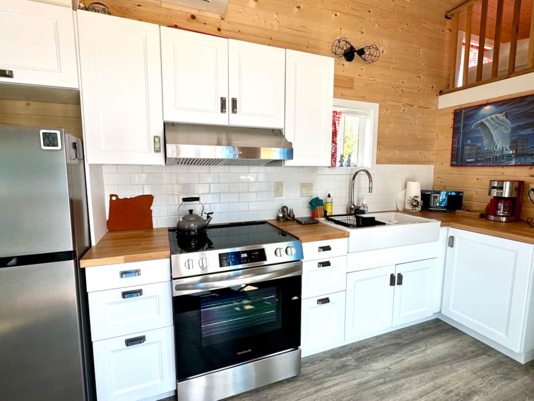 Full kitchen with stove, oven, large refrigerator, microwave, and more! 