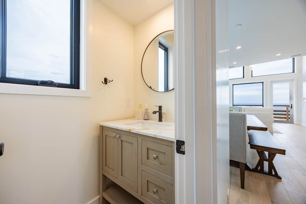 Bathroom near the kitchen at Driftwood Carolina Carolina Beach rental